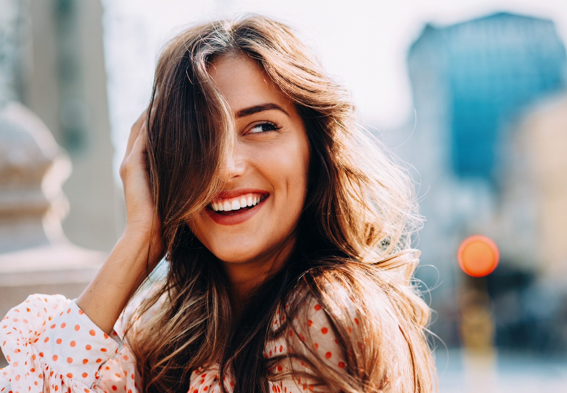 smiling with city in background